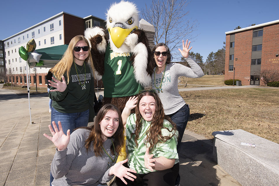 Husson community members pose with Baldwin